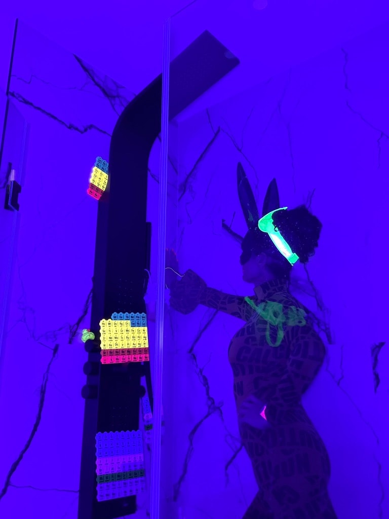 Neon periodic table installation purple lighting